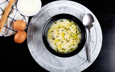 Traditional yayla soup (yoghurt soup) on wooden background
