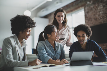 Smiling businesspeople working in office