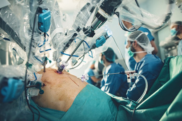 Surgical room in hospital with robotic technology equipment, machine arm surgeon in futuristic operation room. Minimal invasive surgical medical robot,  urology surgery with robotic assisted surgeon