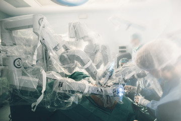 Surgical room in hospital with robotic technology equipment, machine arm surgeon in futuristic...