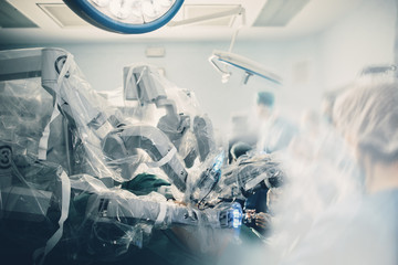 Surgical room in hospital with robotic technology equipment, machine arm surgeon in futuristic...