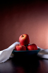 Red apples inside fruit bowl