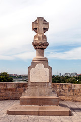Square with a cross surrounded by sky in Spain