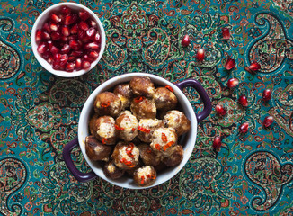 Cajun chicken meatballs in a creamy sauce and pomegranate seeds.