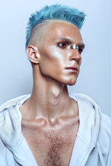 Profile of a handsome man with blue hair