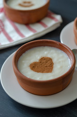 Delicious rice pudding with cinnamon in bowl, closeup