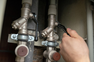 checking fixing water pipes hot cold at home with spanner