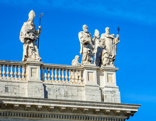 Fototapeta na wymiar Fragment of the balustrade of the Cathedral of St. John the Baptist on the Lateran Hill in Rome