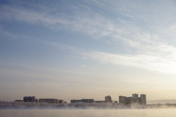 Naklejka premium View of the winter city of Krasnoyarsk from the park