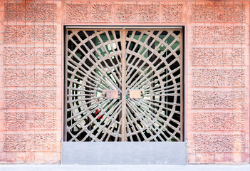 Entrance of old building decorated magnificent wrought-iron gates, forged elements.