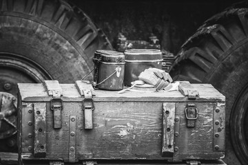Soldier's breakfast in a military pot on the boxes