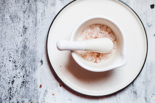Pink Himalayan salt in a mortar