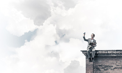 Fototapeta premium Young businessman or student studying the science on building ro