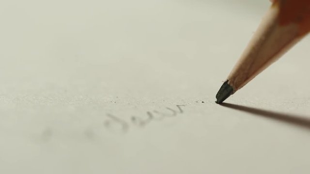 SLOW MOTION: A pencil core breaks while writing