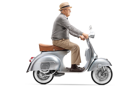 Fototapeta Senior gentleman riding a vintage scooter