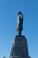Nakhimov monument in the Central square of the city against the blue sky.