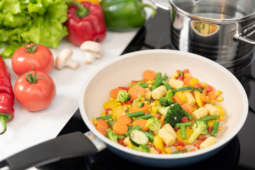 Fresh vegetables fried in a pan. Healthy nutrition concept
