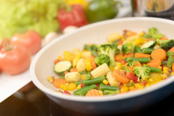 Fresh vegetables fried in a pan. Healthy nutrition concept