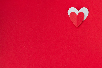 background for Valentine's day and eighth of March, red heart on red background