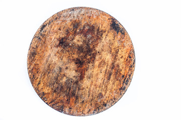 Close up of brown colored textured circular wooden piece isolated on white.