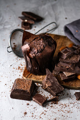Chocolate muffin with broken chocolate bars