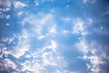 Close up of white and black colored clouds in the blue sky.