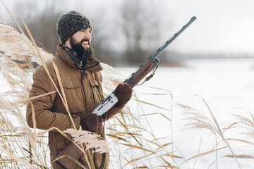 happy laughing hunter is outside. close up photo. copy space. favourite hobby