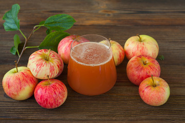 Delicious fresh squeezed apple juice in  transparent glass