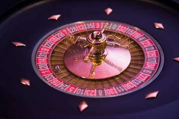 Gaming table, roulette wheel in motion