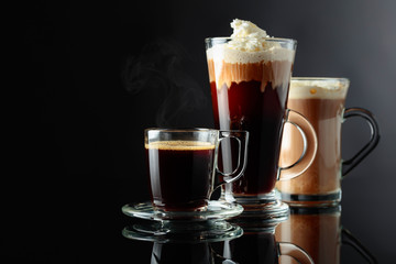 Various coffee drinks on a black background.