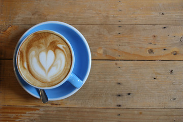Hot coffee cup on wooden table backgrounds, top views.