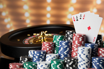 Poker Chips, Roulette wheel in motion, casino background