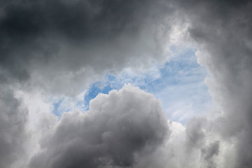 Fototapeta na wymiar Hole of the sky and storm clouds