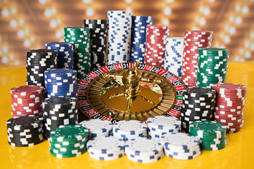 Poker Chips, Roulette wheel in motion, casino background