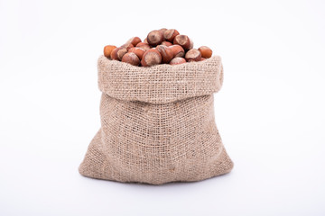 Hazelnuts in rustic sack bag