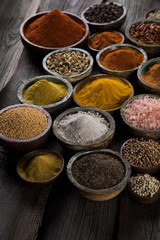 Variety of spices and herbs on kitchen table