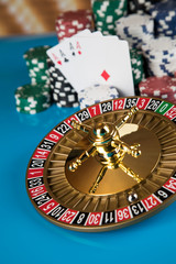 Poker Chips, Roulette wheel in motion, casino background