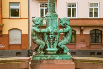 Obraz premium Vintage metal sculptures for children are installed on the bridge in Frankfurt am Main. Germany