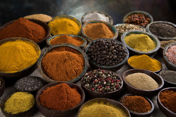 Variety of spices and herbs on kitchen table