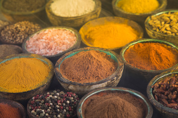 Variety of spices and herbs on kitchen table