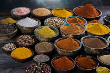 Variety of spices and herbs on kitchen table