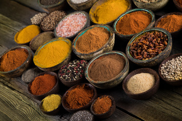 Aromatic spices on wooden background