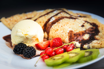 Fresh fruits mix with vanilla ice cream and crepe.