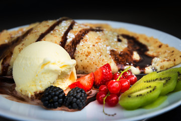Fresh fruits mix with vanilla ice cream and crepe.