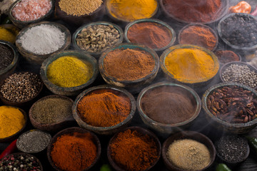 Fototapeta na wymiar Hot spices in wooden bowls