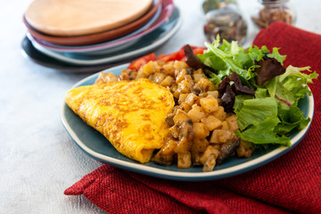 French Omelette with Potatoes, Mushroom and Salad