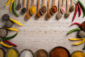 Variety of spices and herbs on kitchen table