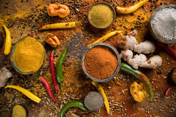 Variety of spices and herbs on kitchen table
