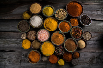 Aromatic spices on wooden background