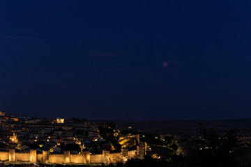 Fototapeta premium a panorama of a lunar eclipse or red moon next to Mars 